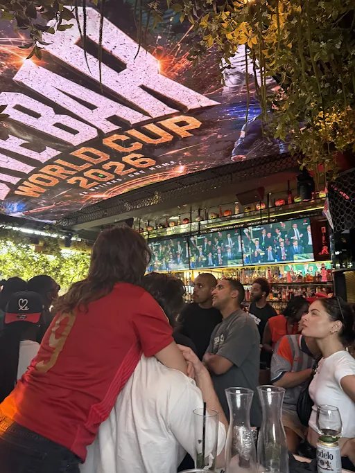 A packed bar with the World Cup 2026 sign overhead